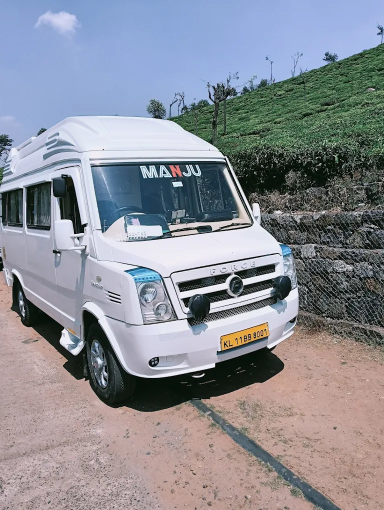 Tempo Traveller parked in Kozhikode ready for rental service, spacious tourist vehicle for group travel in Calicut and Kochi
